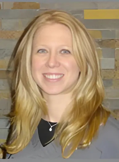 Dr. Jaclyn Altman, Periodontist at Family Tree Dental, smiling